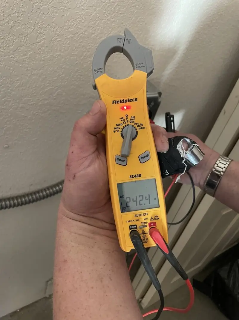 Voltage testing with clamp meter during Ceiling Fan Installation in Brunswick